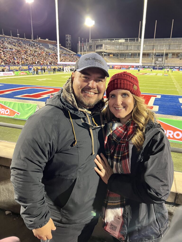 Man and Woman at college football game