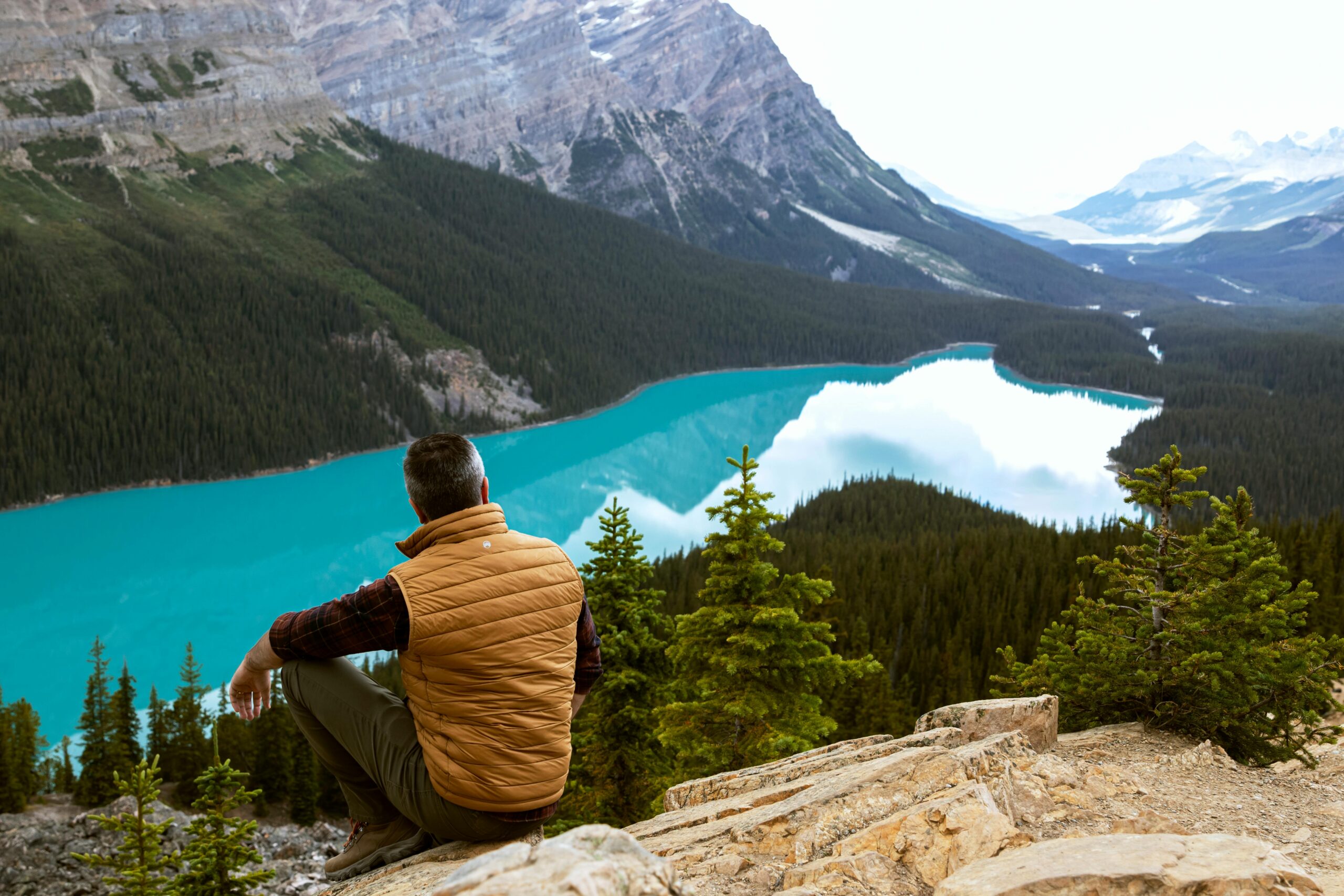 Man overlooking mountain lake